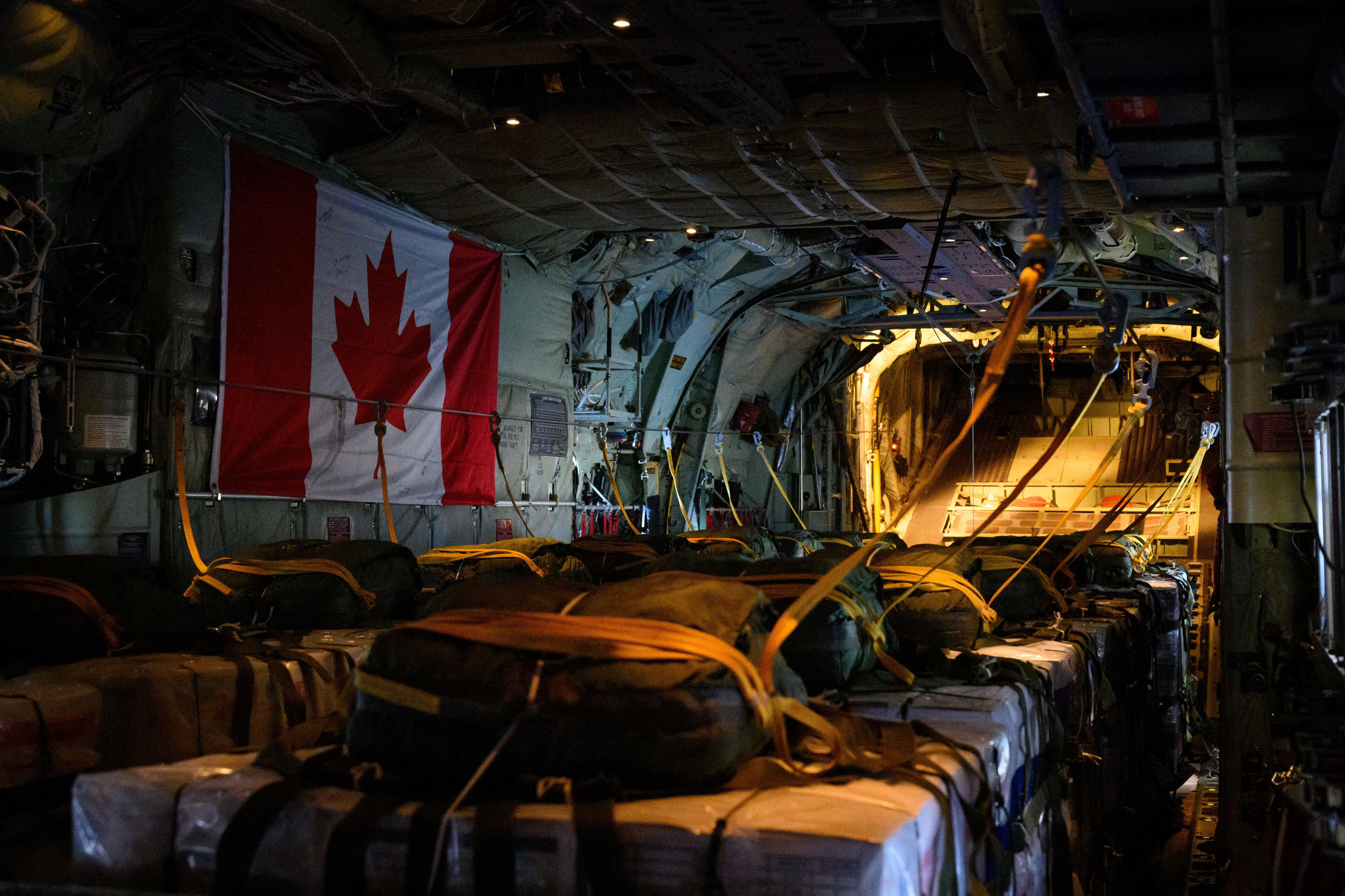 Royal Canadian Air Force CC-130 Hercules transport aircraft airdrops humanitarian aid over the Gaza Strip