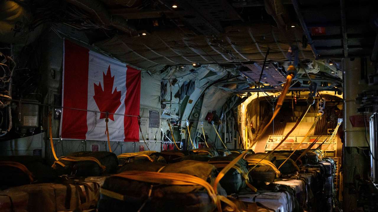 Royal Canadian Air Force CC-130 Hercules transport aircraft airdrops humanitarian aid over the Gaza Strip