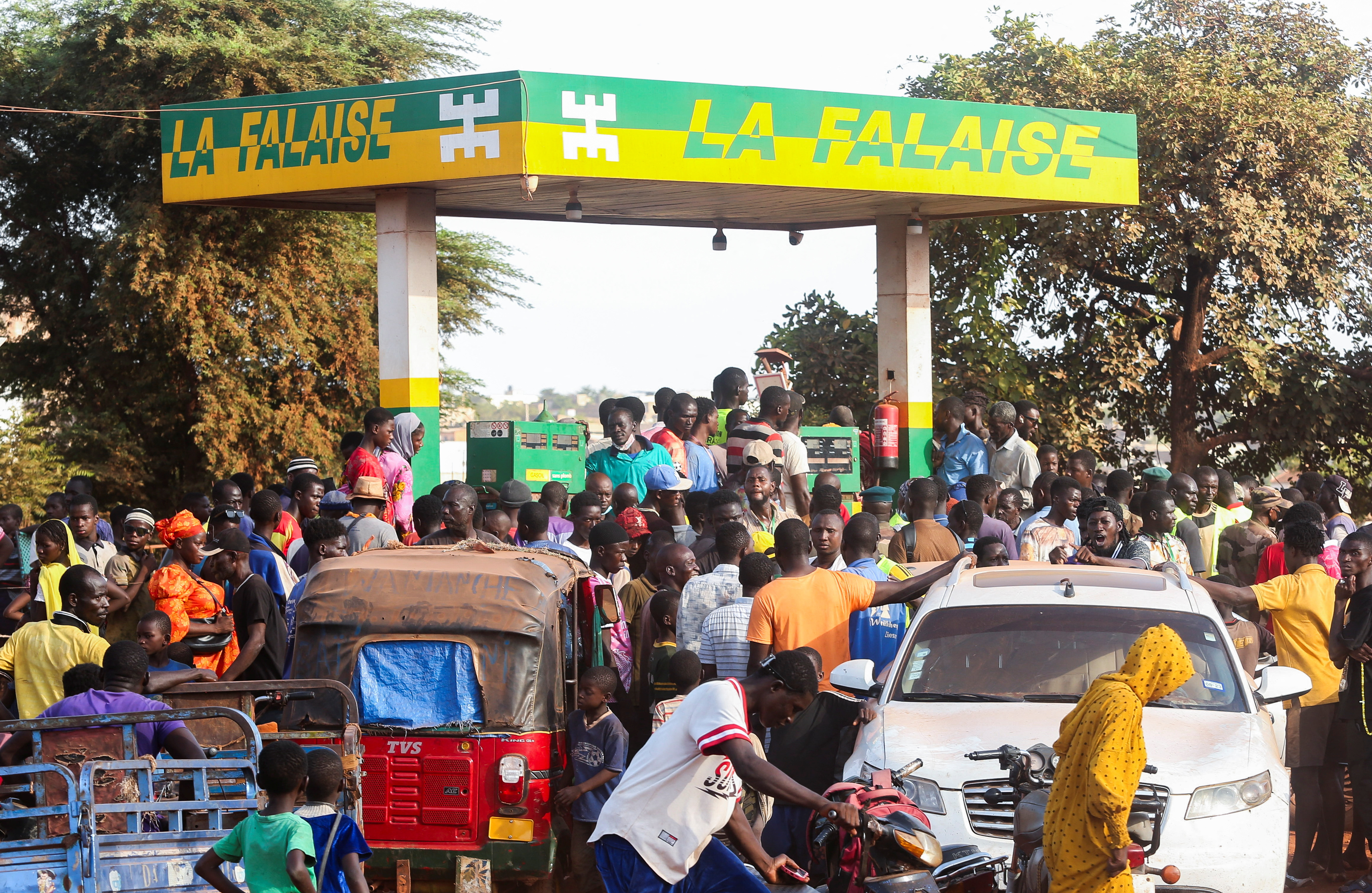 People gather at a petrol station in Bamako, Mali