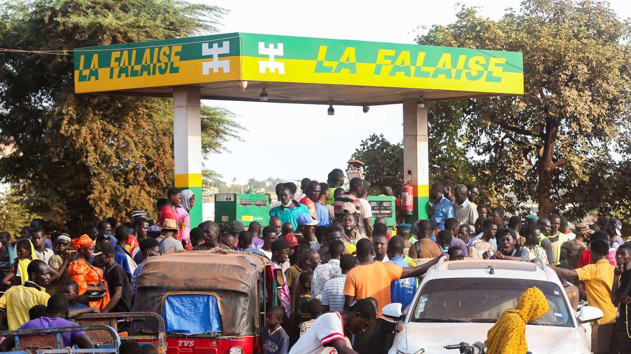 People gather at a petrol station in Bamako, Mali