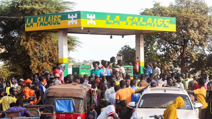 People gather at a petrol station in Bamako, Mali