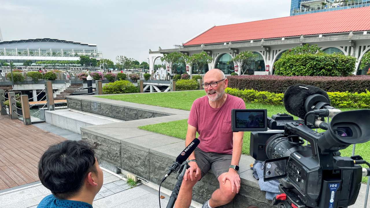 British citizen Davies, a passenger on the Singapore Airlines flight SQ321, attends an interview with Reuters in Singapore