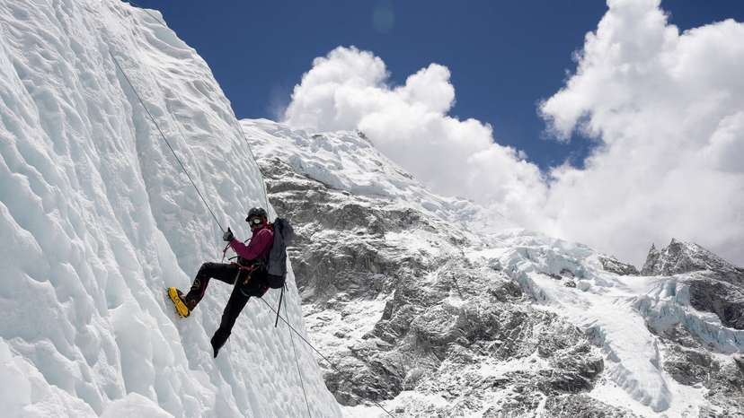 FILE PHOTO: A mountaineer holds on to the rope during an ice climbing session at Everest base camp