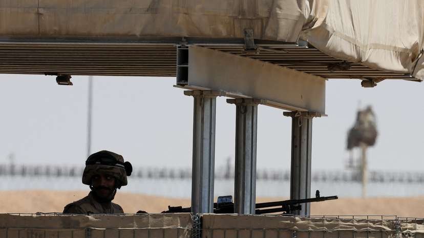 An Egyptian soldier looks on near the Rafah border crossing between Egypt and the Gaza Strip, in Rafah