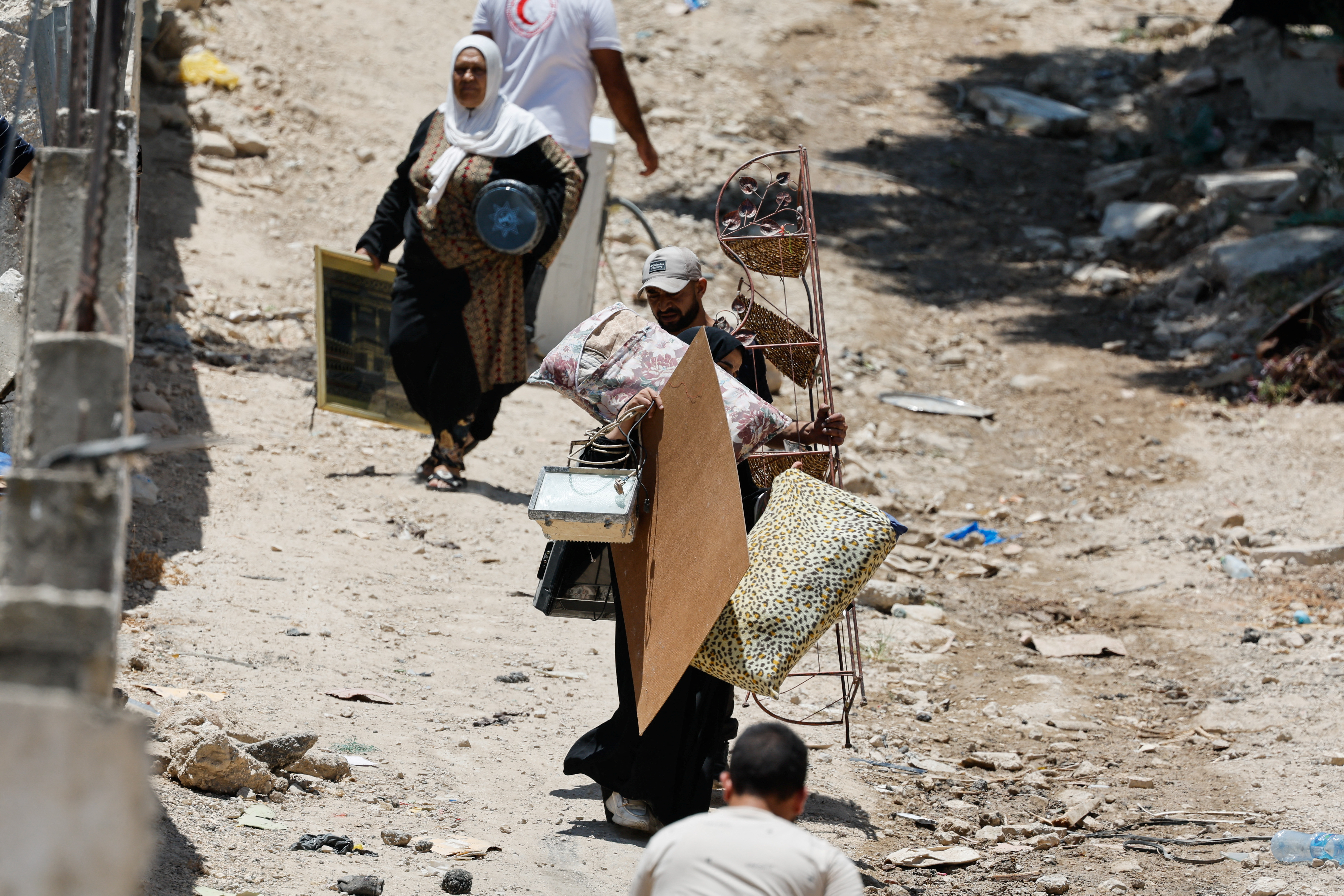 Palestinians remove belongings from their homes threatened with demolition, in Tulkarm camp