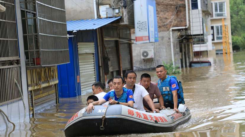 Rescue workers evacuate residents stranded by floodwaters in Shaodong