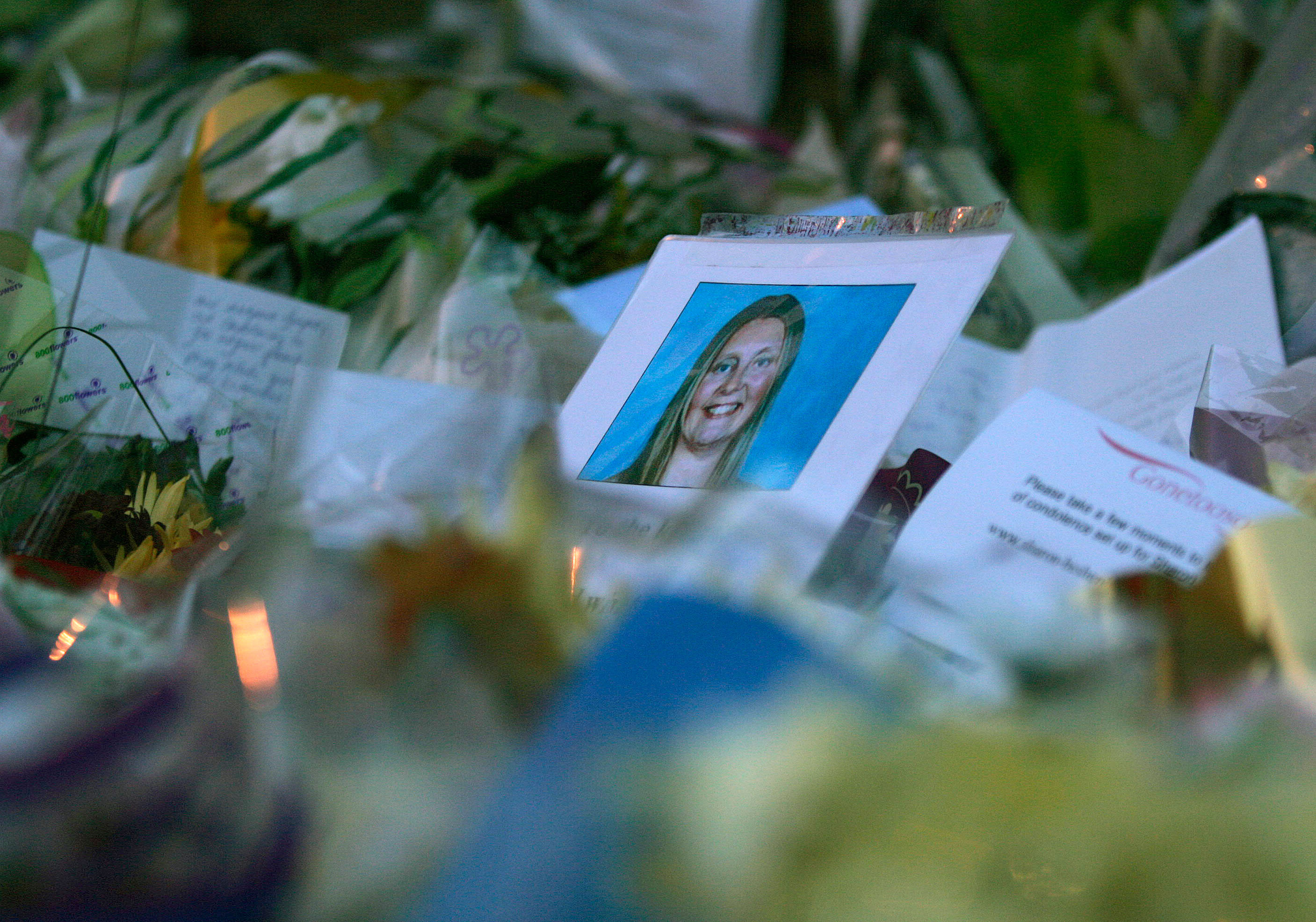 Photograph of murdered Beshenivsky is seen among floral tributes left by well-wishers in Bradford