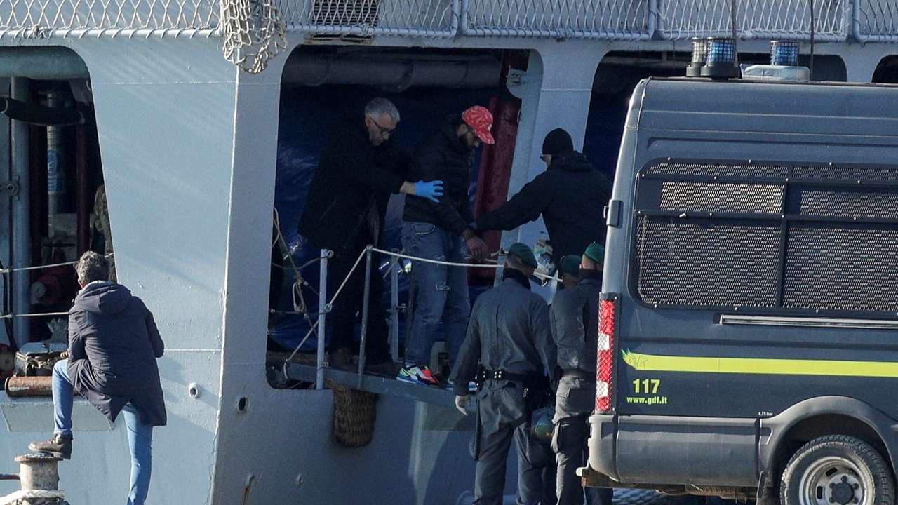 Italian navy ship, carrying migrants as part of a deal with Italy, arrives in Albania