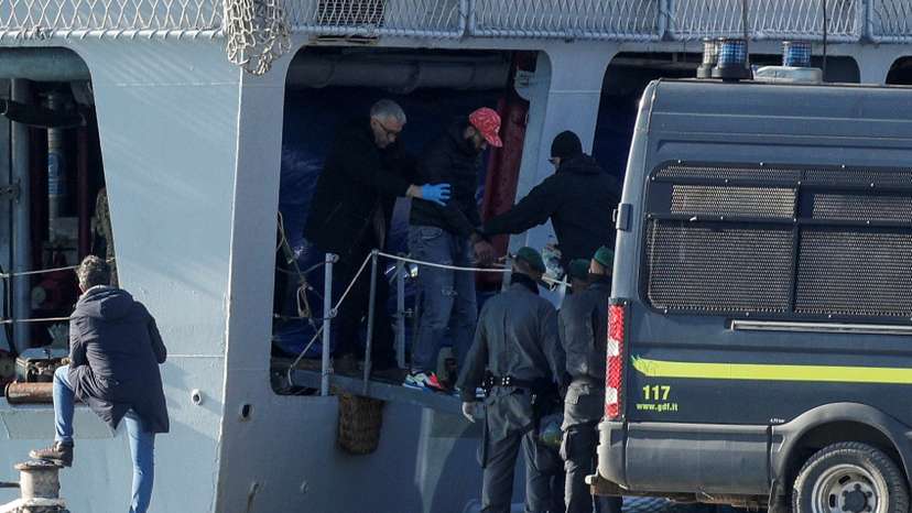 Italian navy ship, carrying migrants as part of a deal with Italy, arrives in Albania
