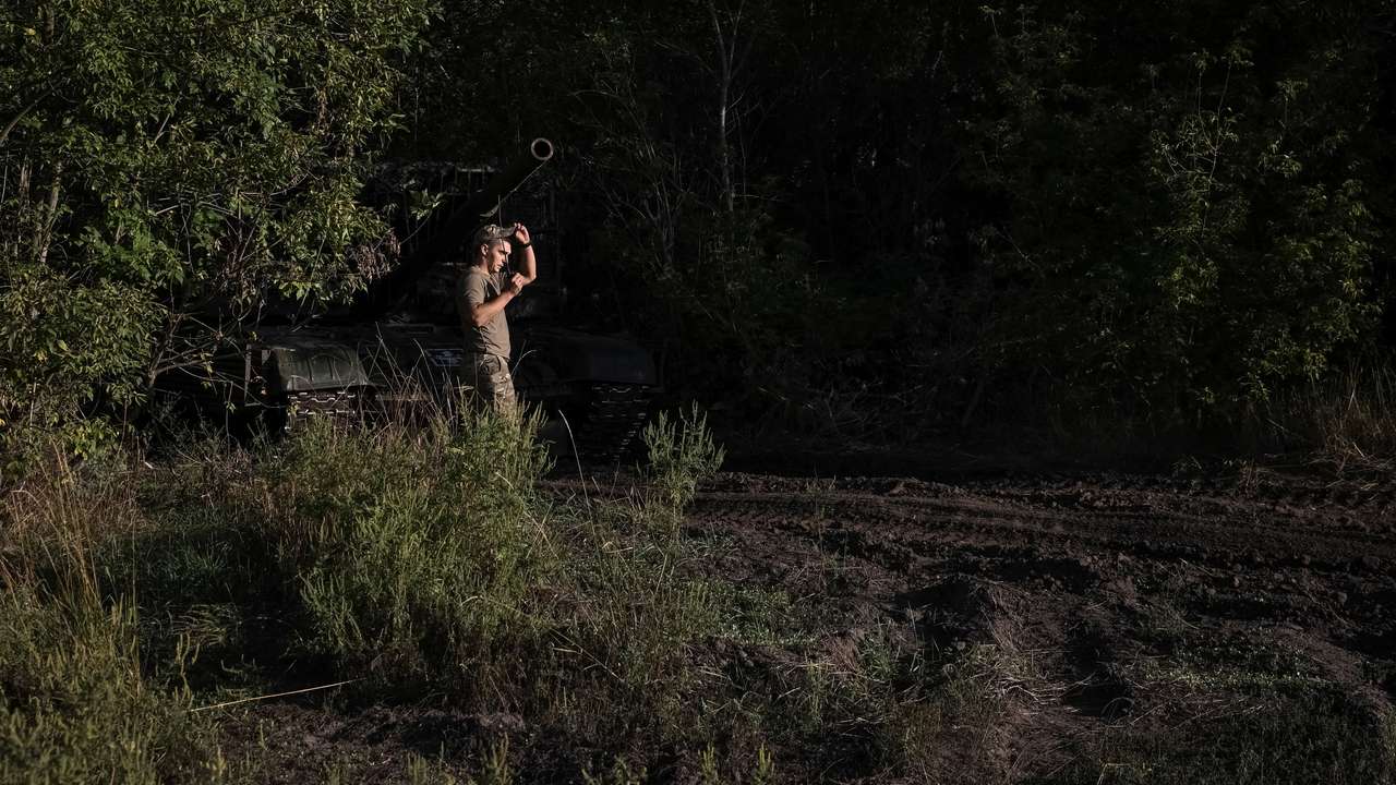 Ukrainian serviceman prepare a tank to fire towards Russian troops at a position near a front line in Donetskk region