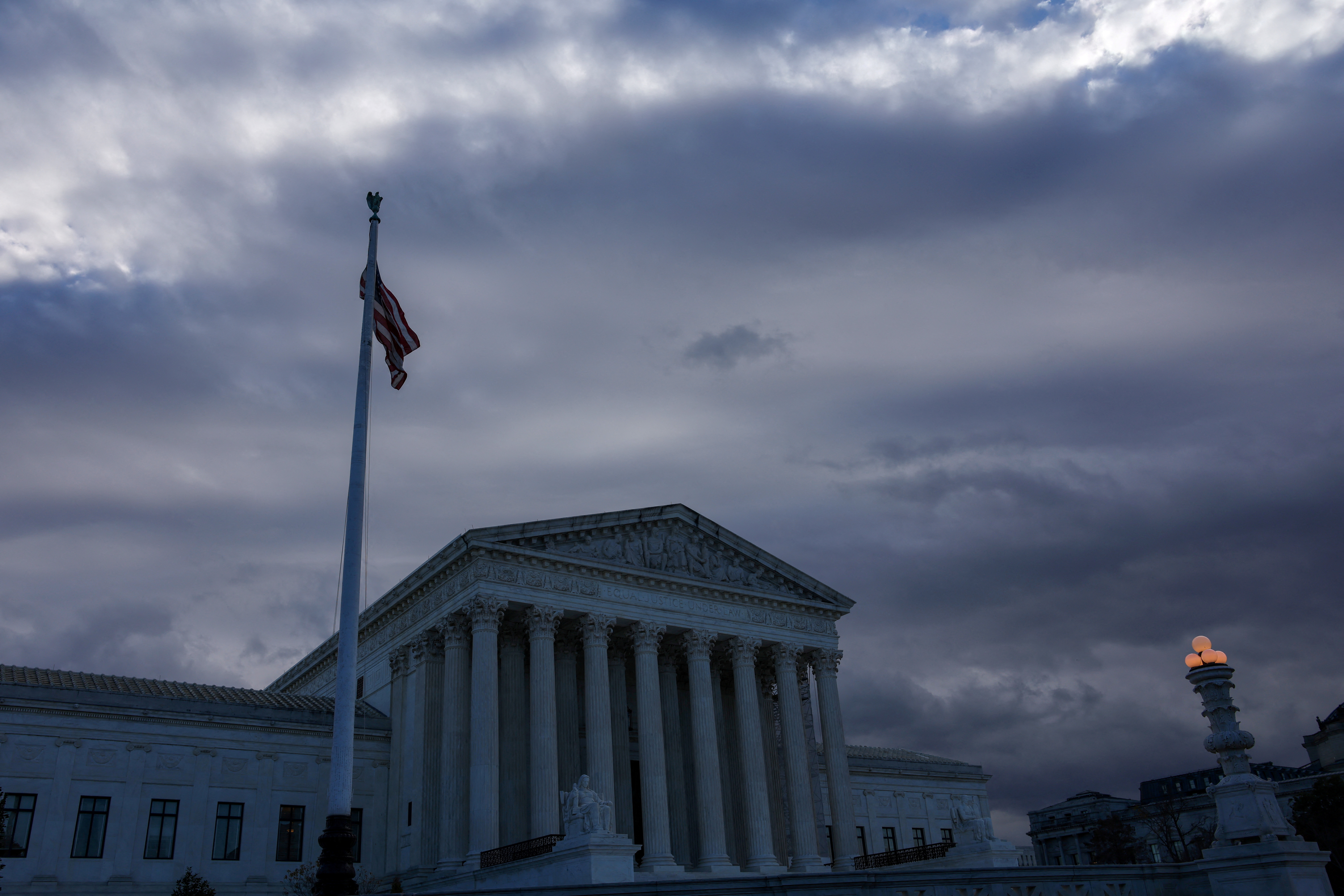 FILE PHOTO: U.S. Flag flutters outside of the United States Supreme Court Building in Washington