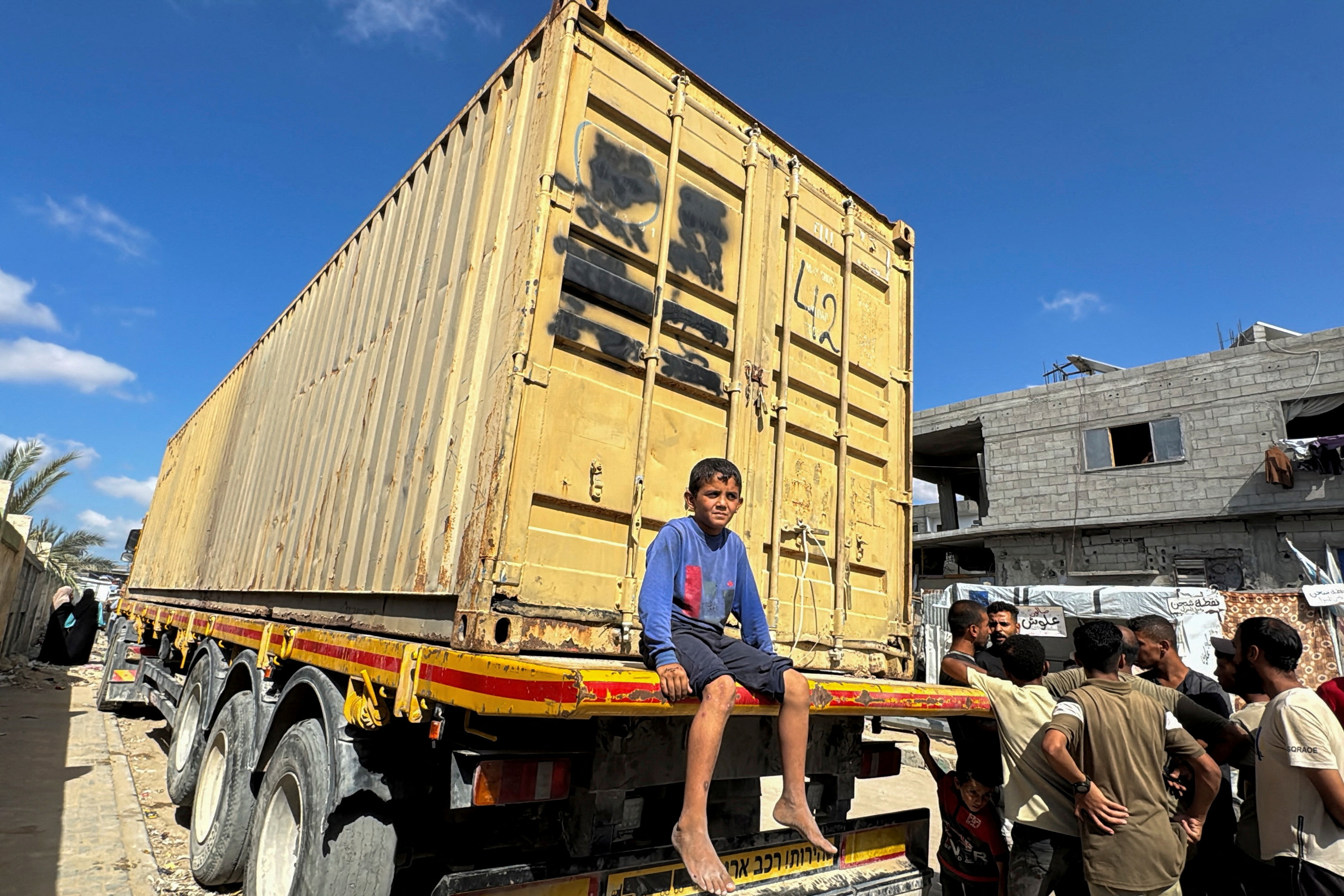 Israel sends scores of bodies to Gaza; Palestinians demand details before burying them