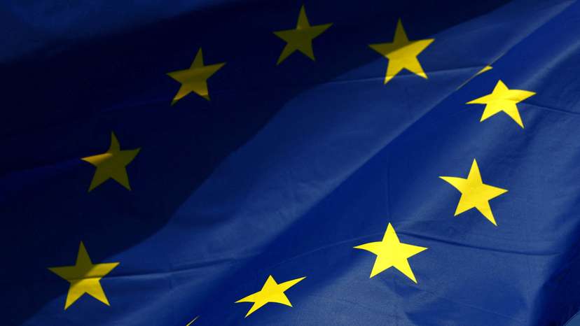 FILE PHOTO: A European Union flag flutters outside the European Commission headquarters in Brussels