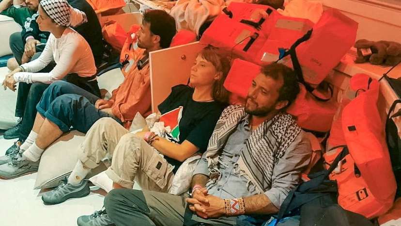Swedish activist Greta Thunberg and Brazilian activist Thiago Avila sit in a vessel with members of the Global Sumud Flotilla, making their way to Israel