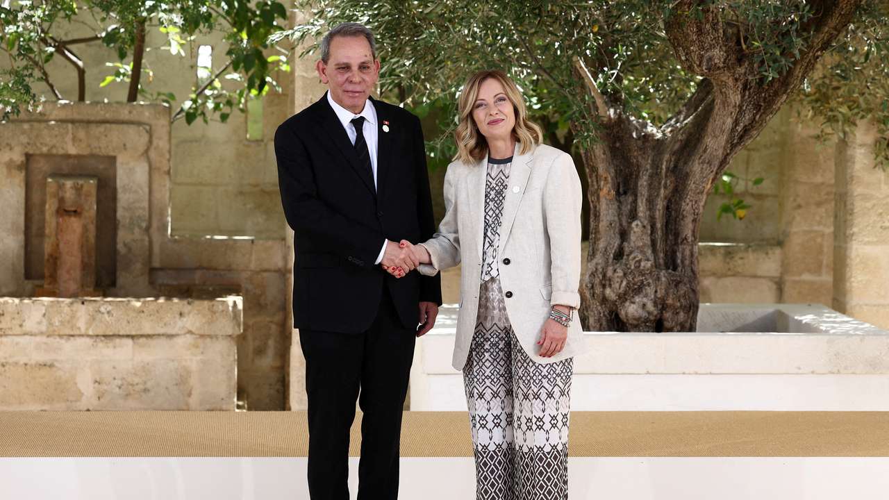 FILE PHOTO: Tunisia's Prime Minister Ahmed Hachani is welcomed by Italian Prime Minister Giorgia Meloni on the second day of a G7 summit in Italy
