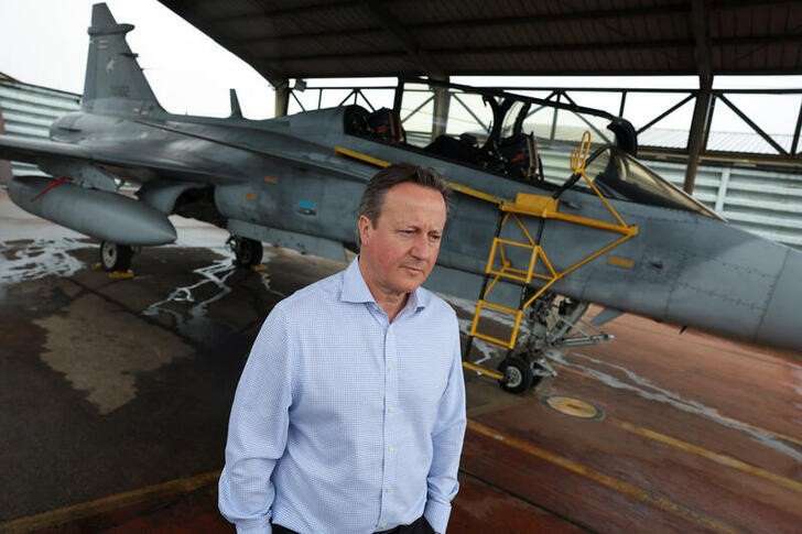 FILE PHOTO: British Foreign Secretary and former Prime Minister David Cameron speaks to Reuters in Nakhon Ratchasima