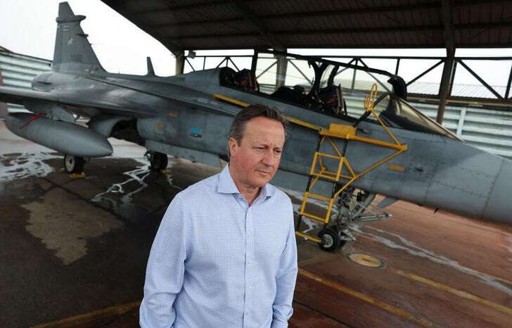 FILE PHOTO: British Foreign Secretary and former Prime Minister David Cameron speaks to Reuters in Nakhon Ratchasima