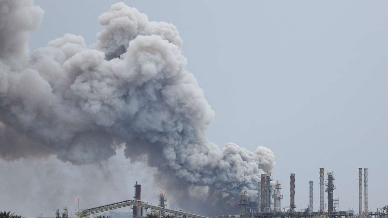 Smoke rises following a strike in Sitra Island