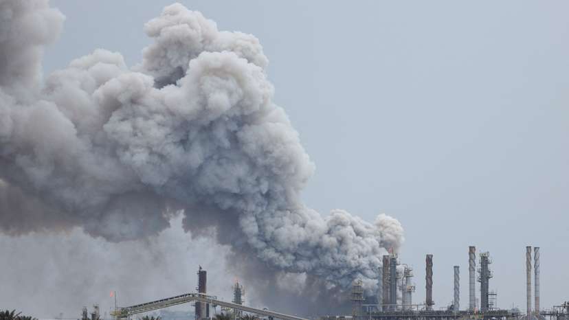 Smoke rises following a strike in Sitra Island