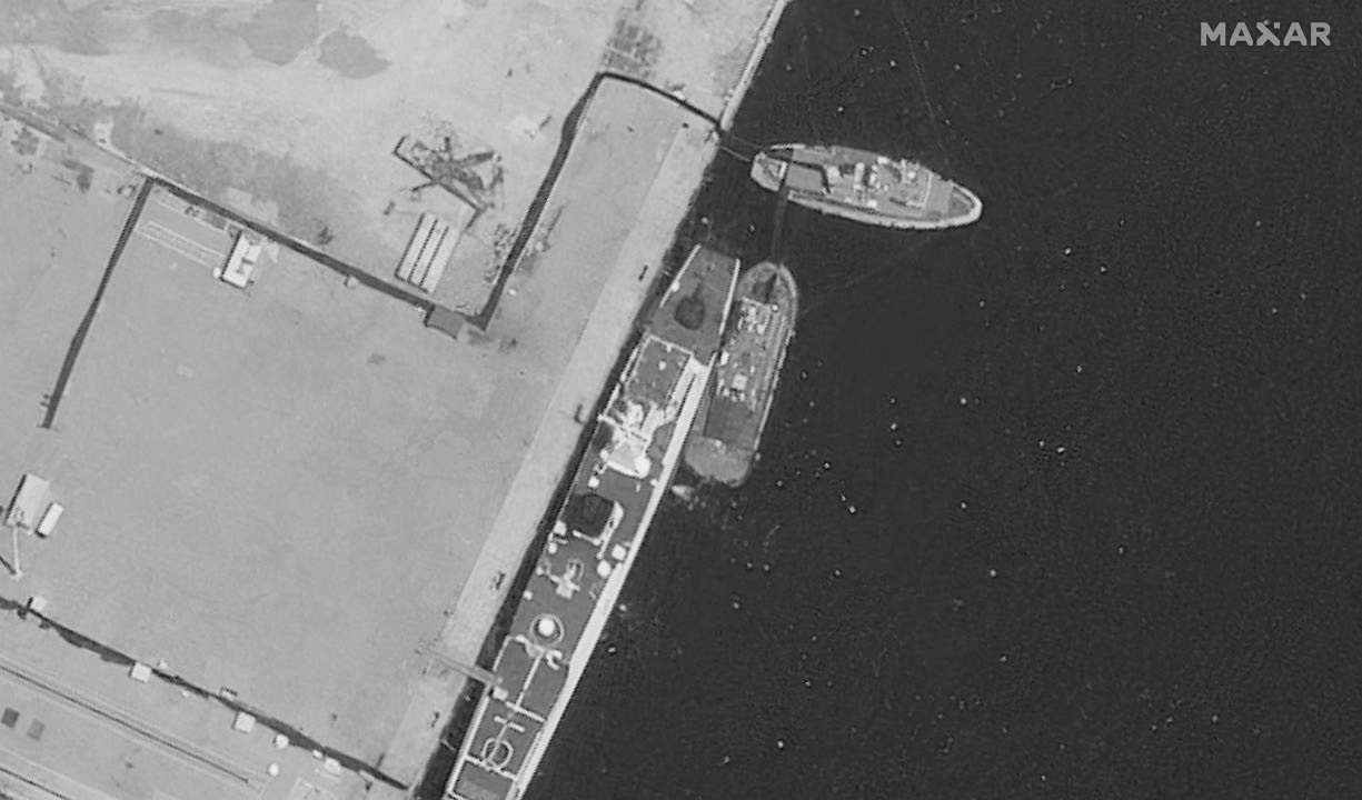 A satellite image of a recently-damaged Chinese coast guard vessel under repair, in the Yulin Naval Base, in Sanya