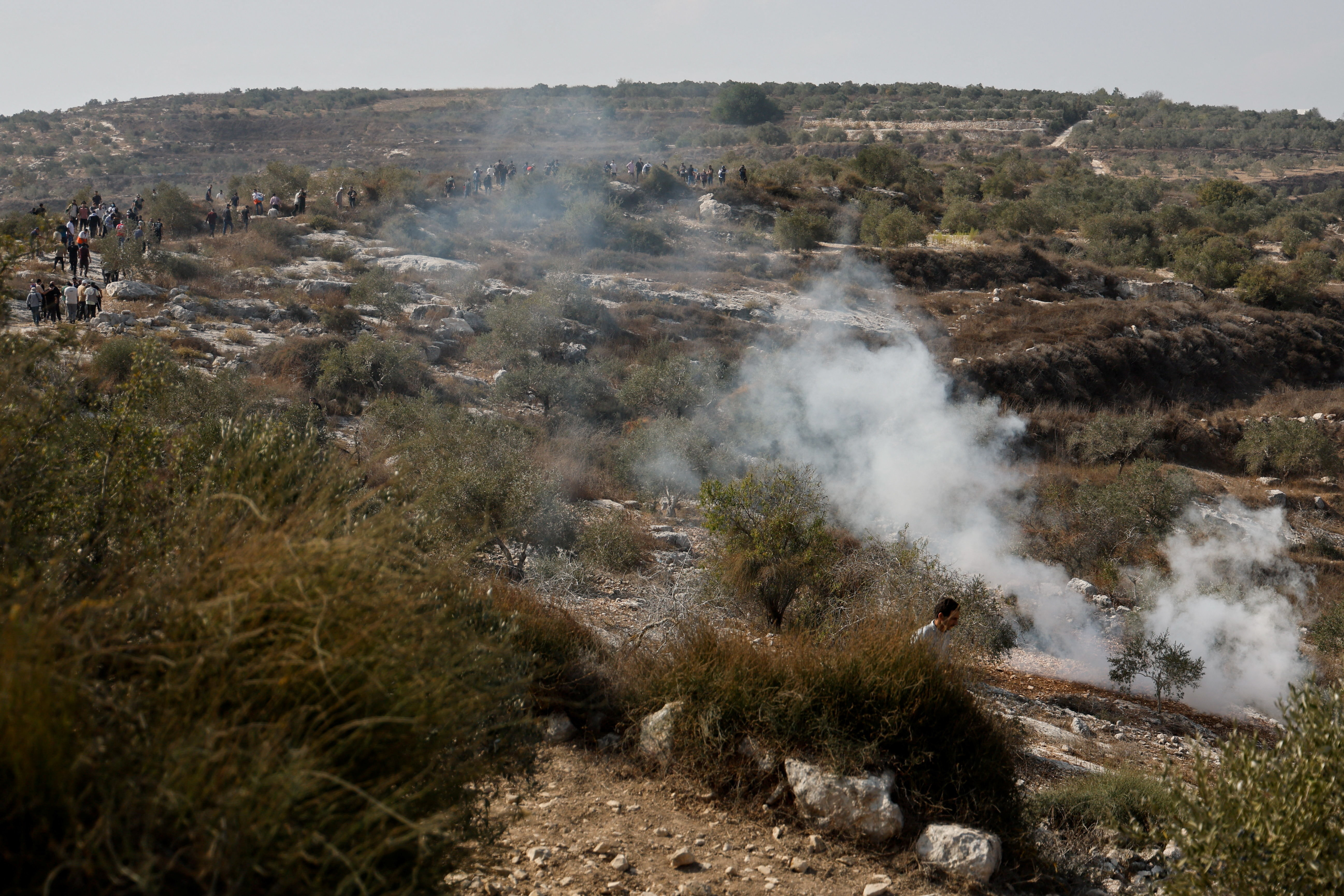 Israeli soldiers clash with Palestinian protesters who went out to pray on their land, in Beit Lid