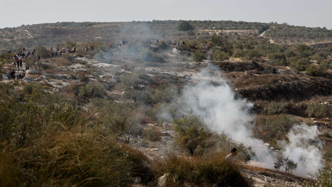 Israeli soldiers clash with Palestinian protesters who went out to pray on their land, in Beit Lid