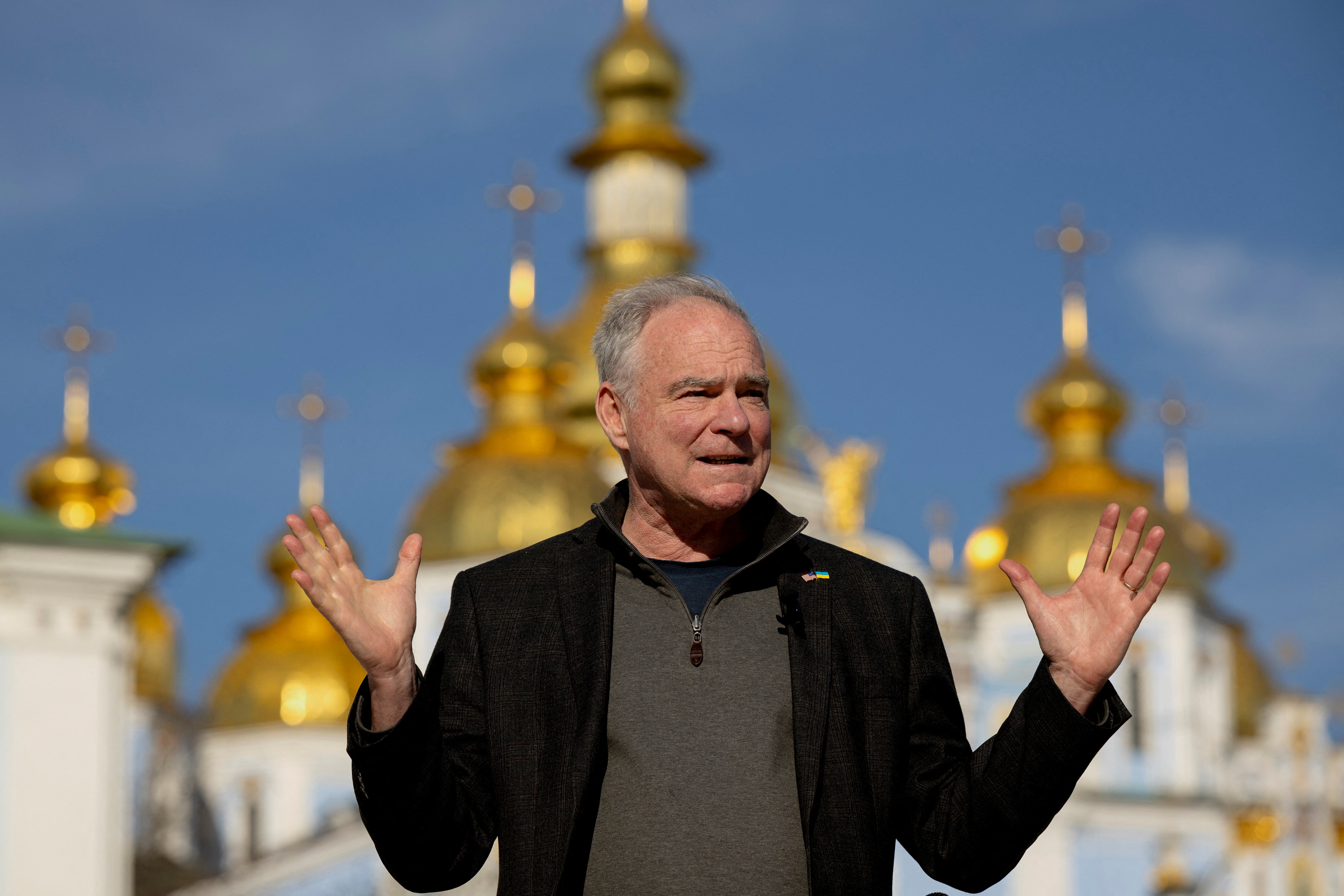 U.S. Senator Tim Kaine speaks to members of the media in front of Saint Michael's Cathedral in Kyiv