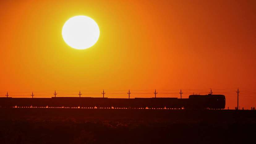 FILE PHOTO: A freight train moves during sunset in the Almaty region
