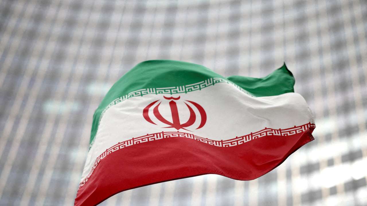 FILE PHOTO: Iranian flag flies in front of the UN office building in Vienna