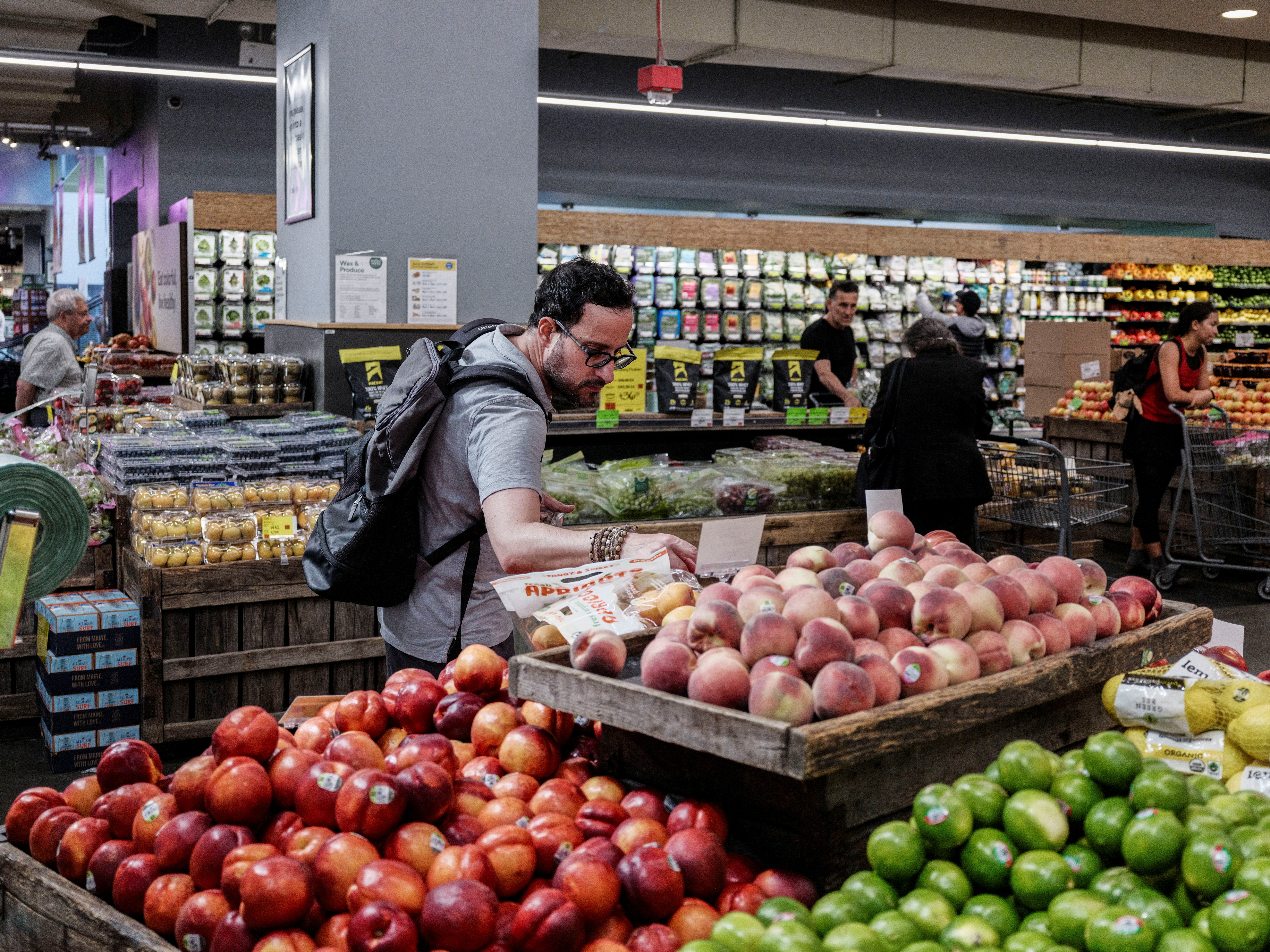 A person shops for groceries in New York City
