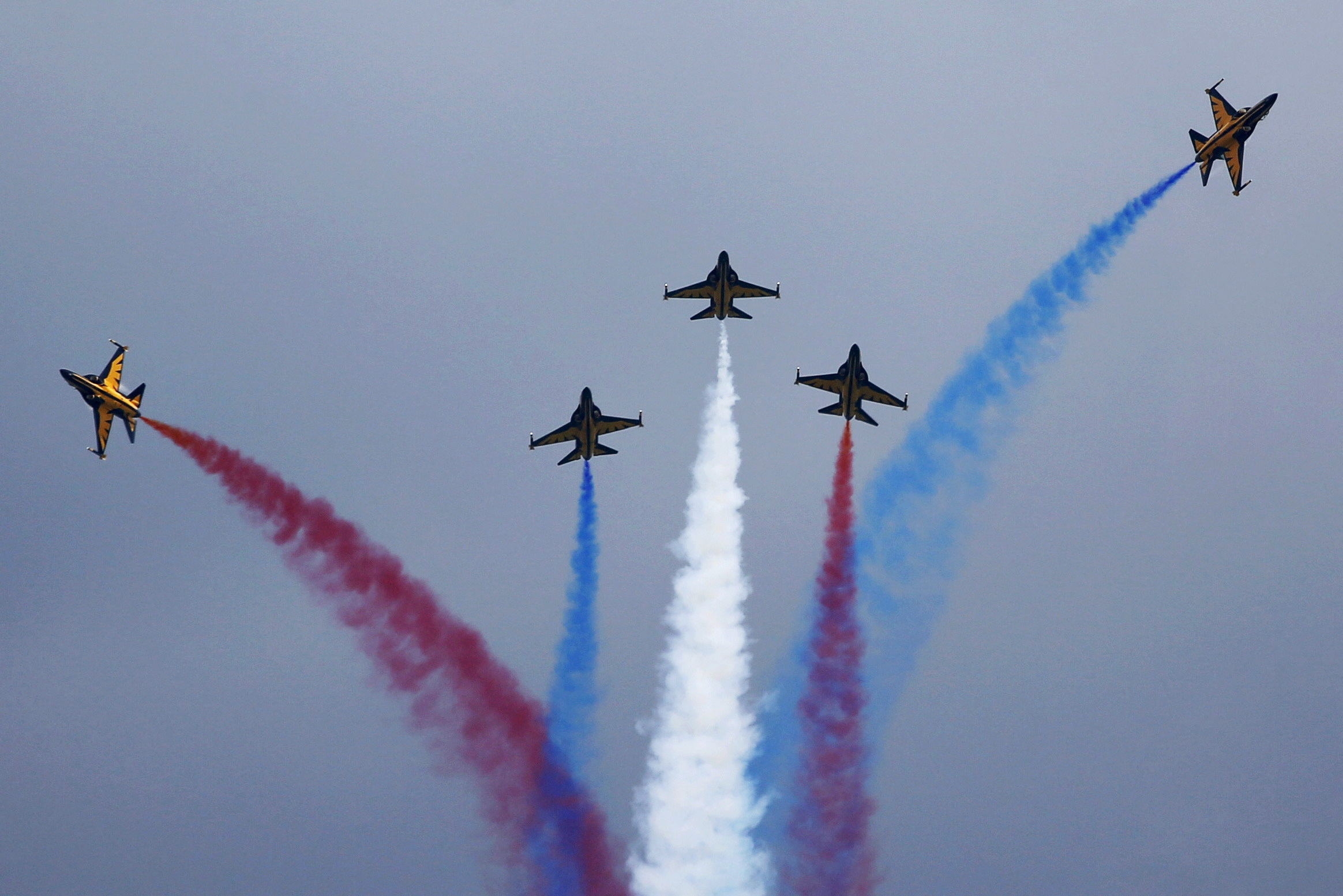 FILE PHOTO: South Korea's Black Eagles aerobatics team perform a manoeuvre during an aerial display at the Singapore Airshow at Changi Exhibition Center