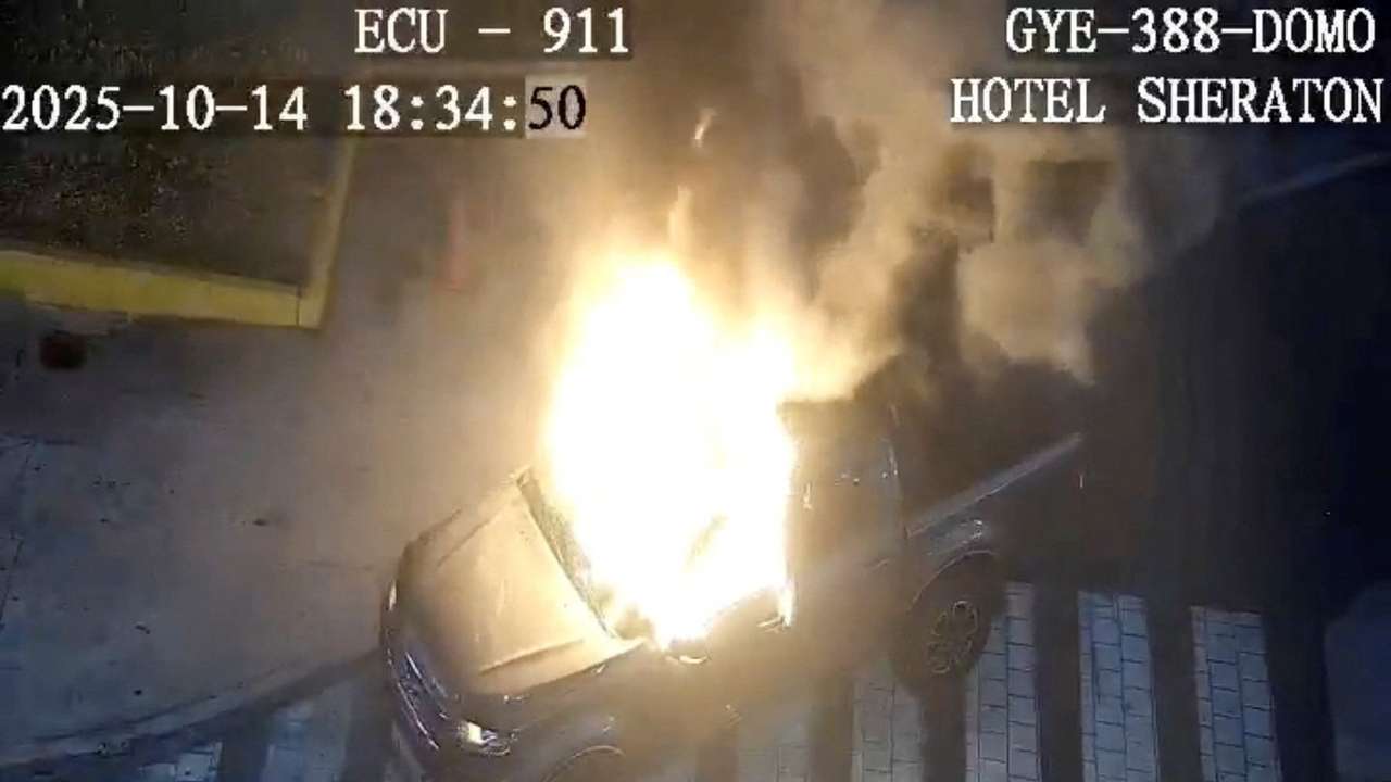 Flames rise from a vehicle that exploded outside a shopping mall, in Guayaquil