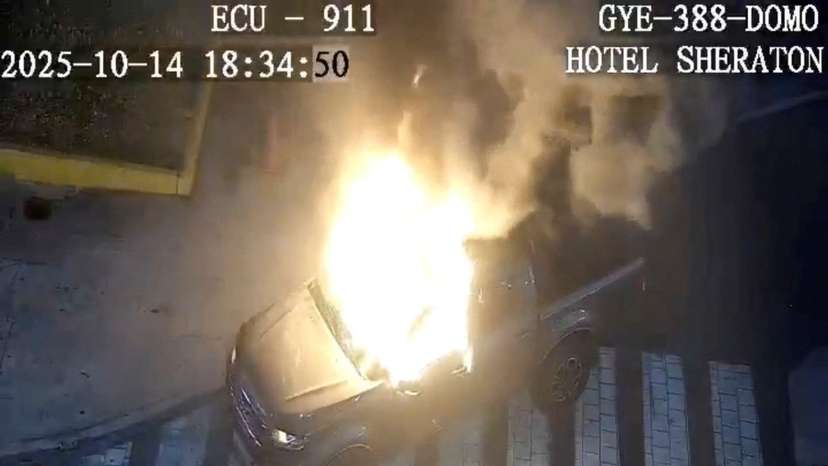 Flames rise from a vehicle that exploded outside a shopping mall, in Guayaquil