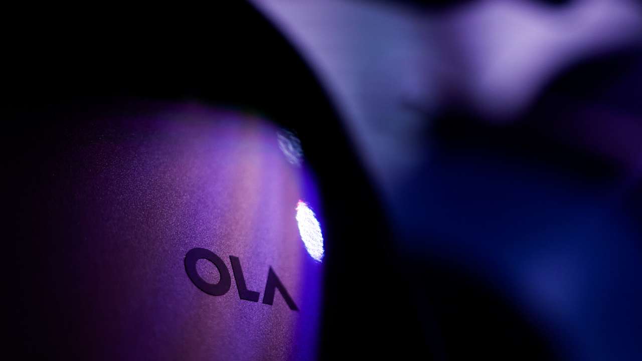 The Ola company logo is seen on one of it's electric scooters ahead of the company's IPO launch in Mumbai