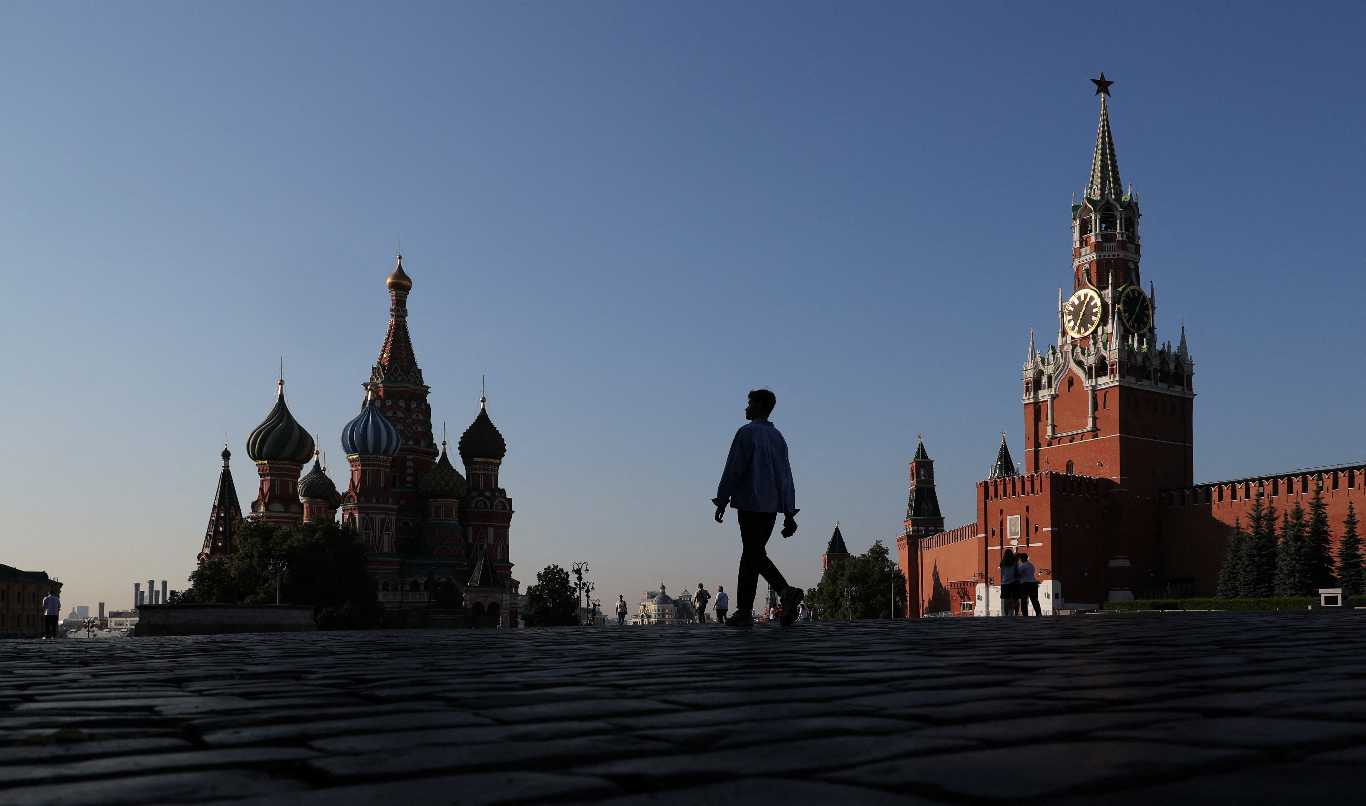 People walk in Red Square in Moscow