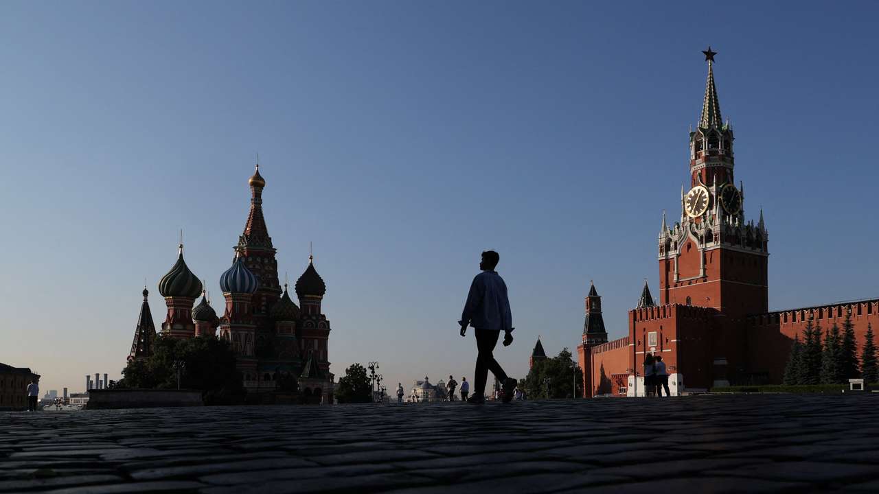 People walk in Red Square in Moscow