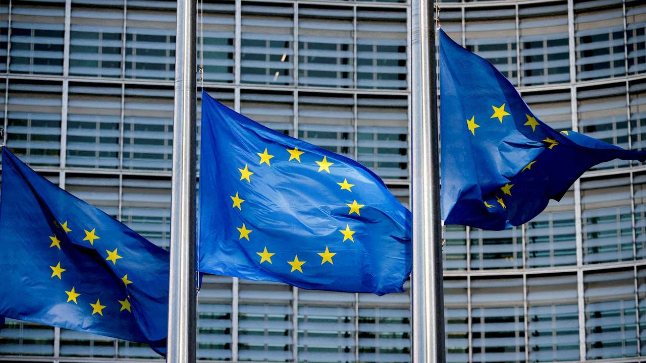 FILE PHOTO: European Union flags fly outside the European Commission headquarters in Brussels