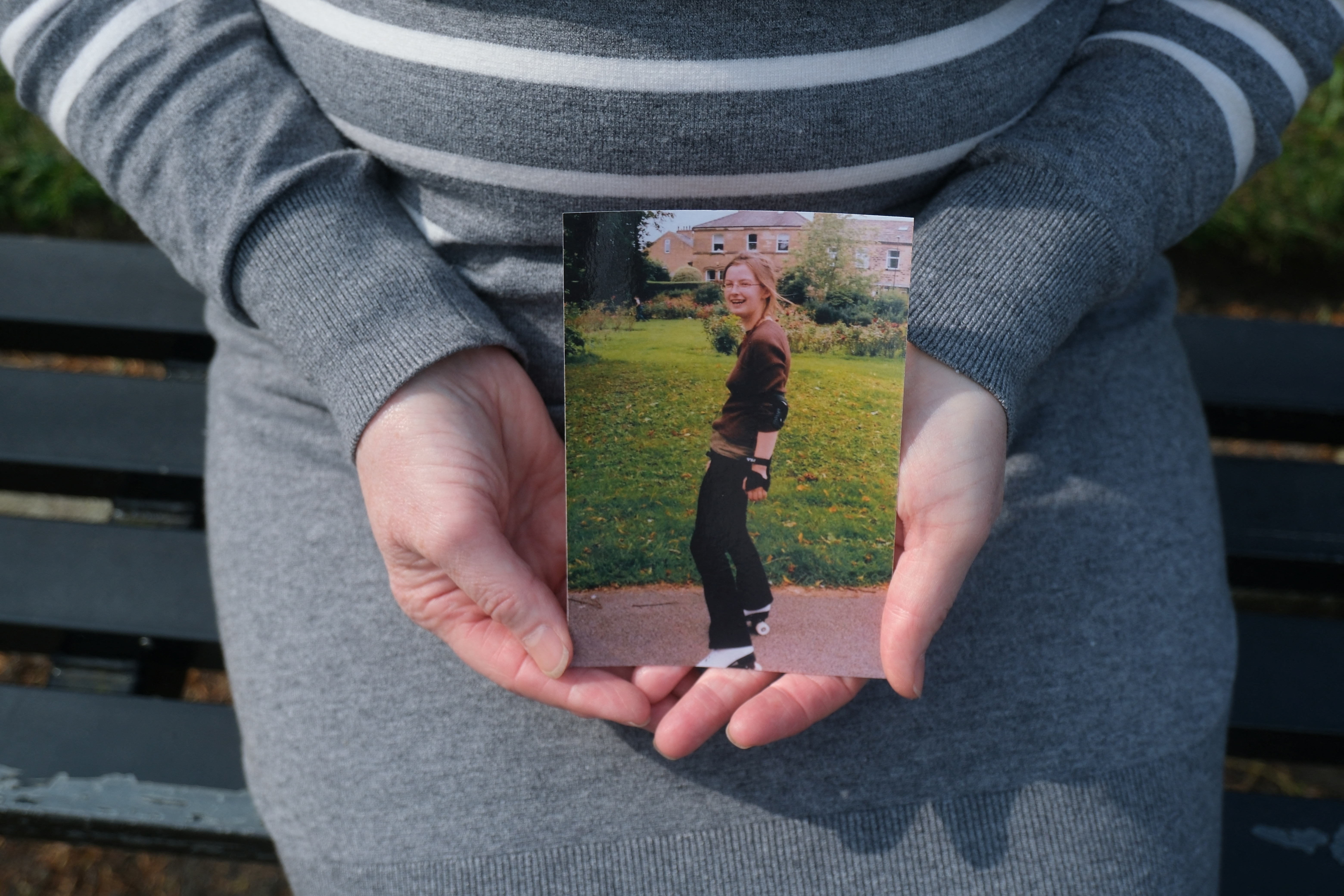 Mother of Bethany Fields holds photo of her daughter, who was killed by an intimate partner, in Leeds