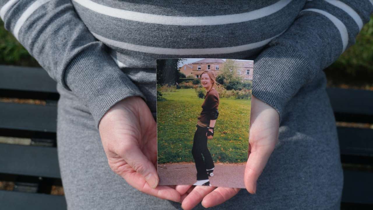 Mother of Bethany Fields holds photo of her daughter, who was killed by an intimate partner, in Leeds