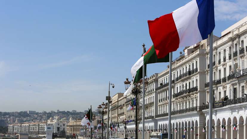 FILE PHOTO: Algerian and French flags flutter ahead of the arrival of French President Emmanuel Macron, in Algiers