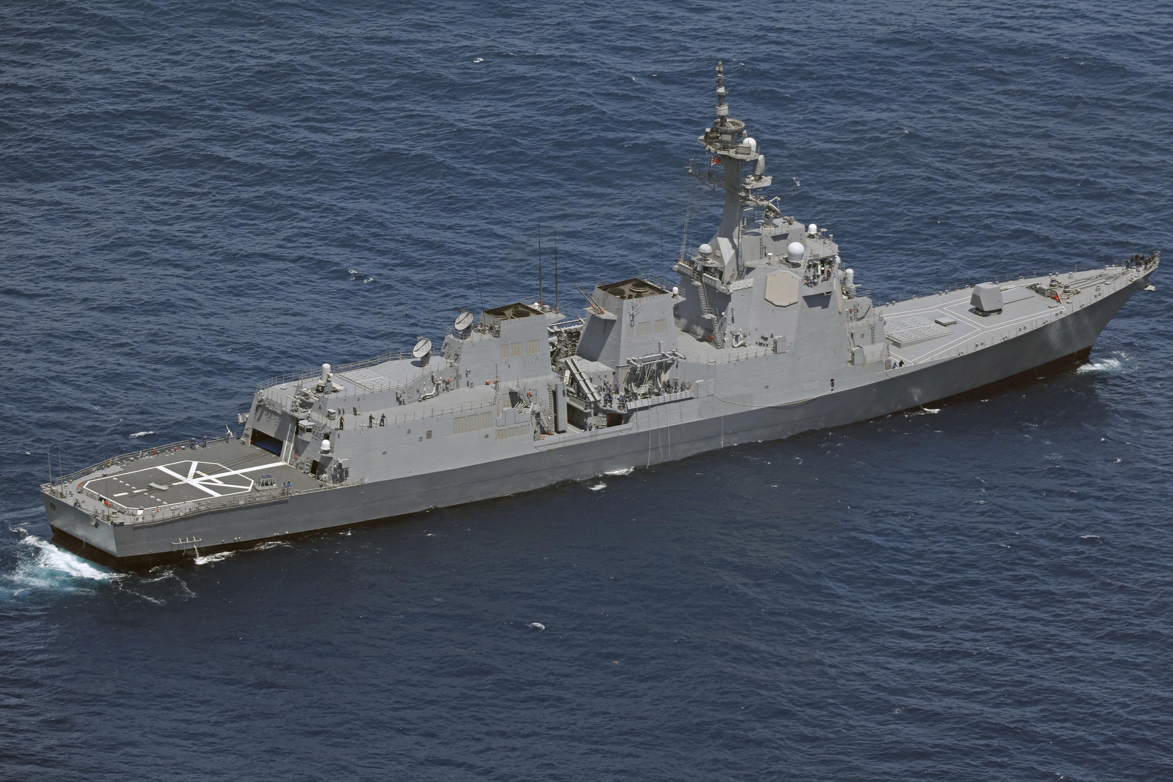 A Japan Maritime Self-Defense Force (JMSDF) vessel conducts a search and rescue operation at the site where two JMSDF helicopters crashed into the sea near Torishima