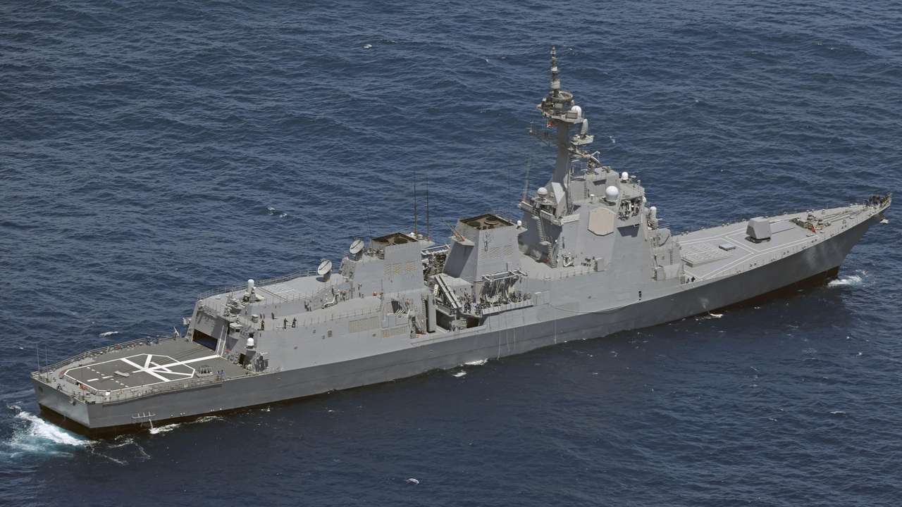 A Japan Maritime Self-Defense Force (JMSDF) vessel conducts a search and rescue operation at the site where two JMSDF helicopters crashed into the sea near Torishima