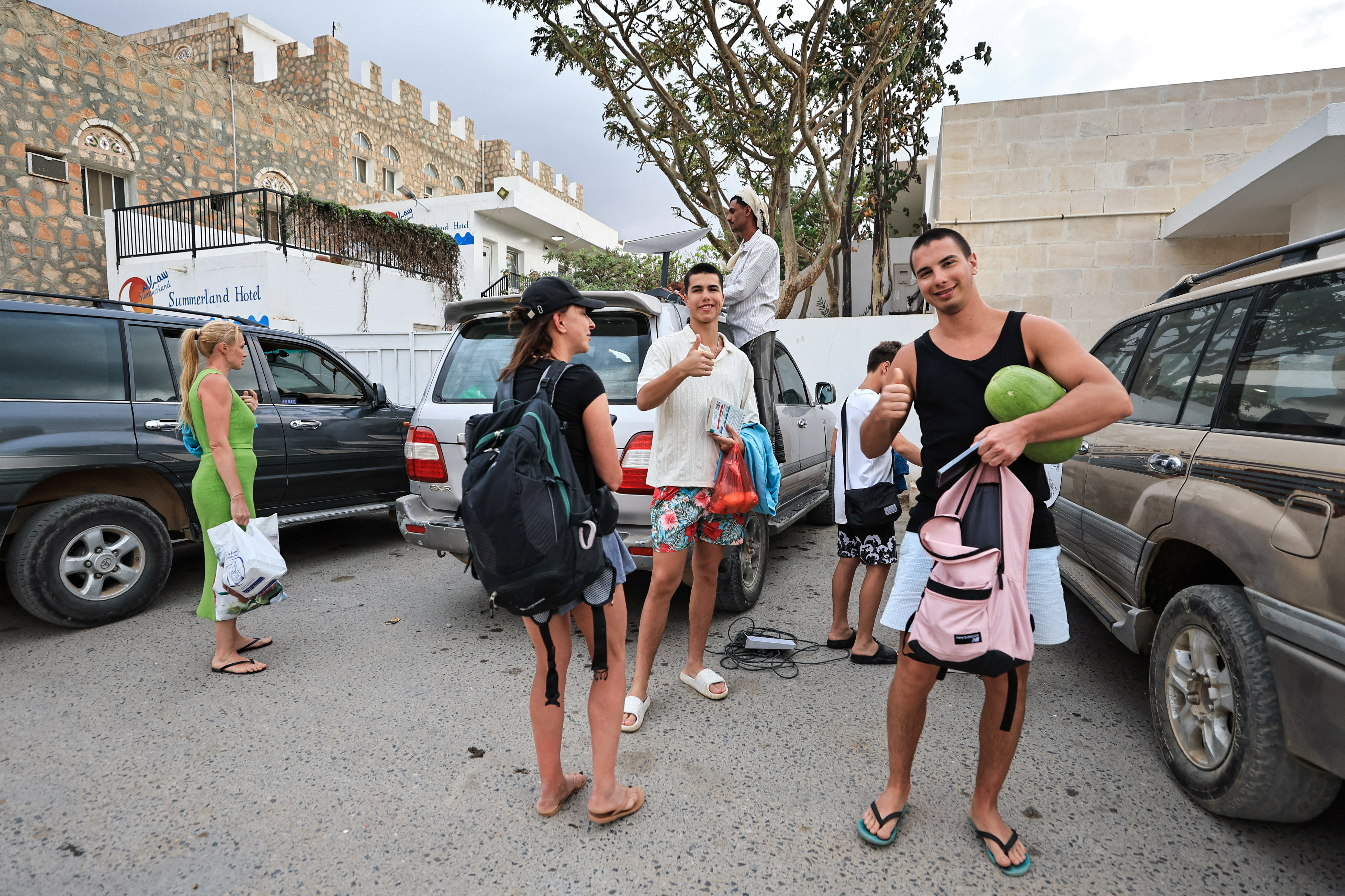 Tourists stand outside a hotel in the Socotra Island, Yemen