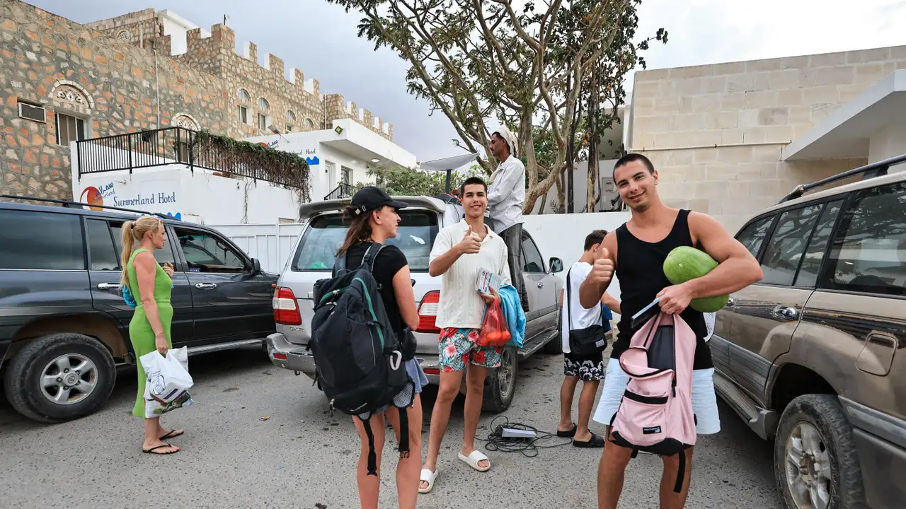 Tourists stand outside a hotel in the Socotra Island, Yemen
