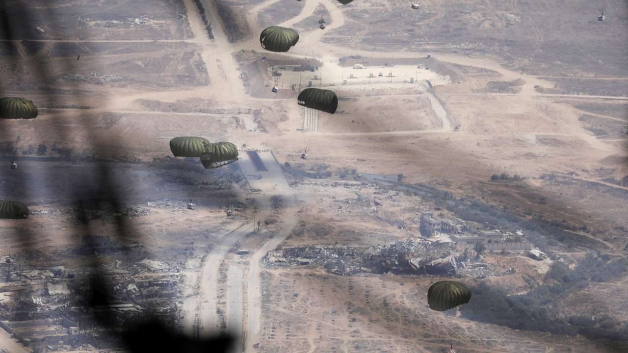 Jordanian military personnel airdrop aid parcels over Gaza