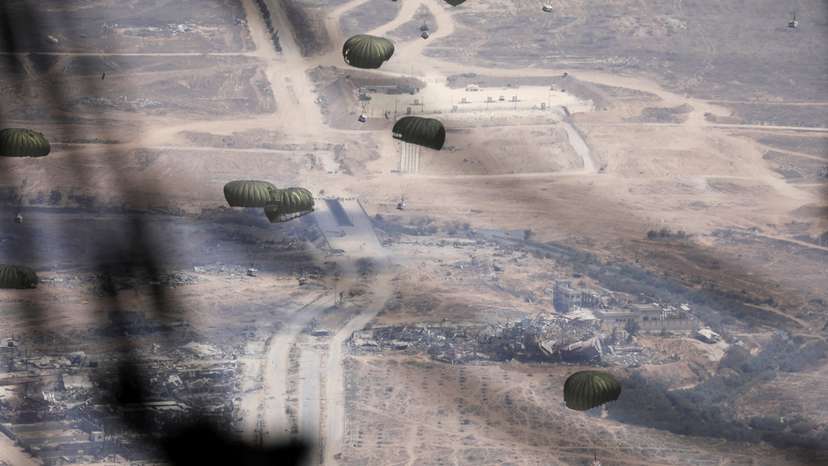 Jordanian military personnel airdrop aid parcels over Gaza