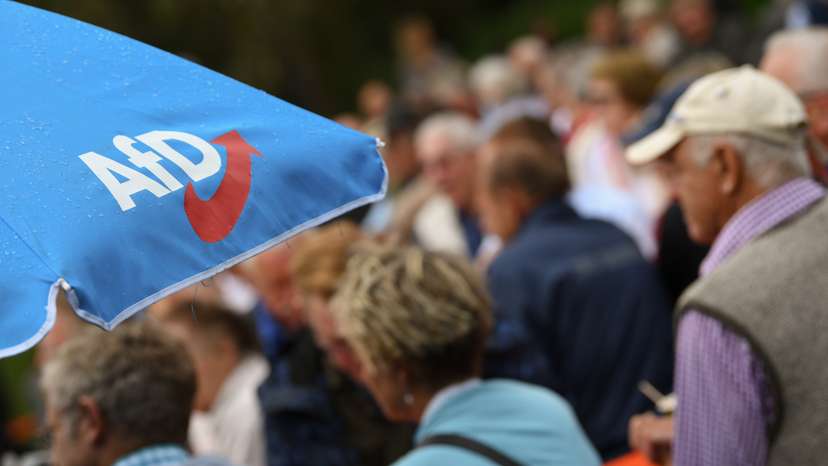 Supporters of the Alternative for Germany (AfD) attend their party's event at the Gillamoos Fair