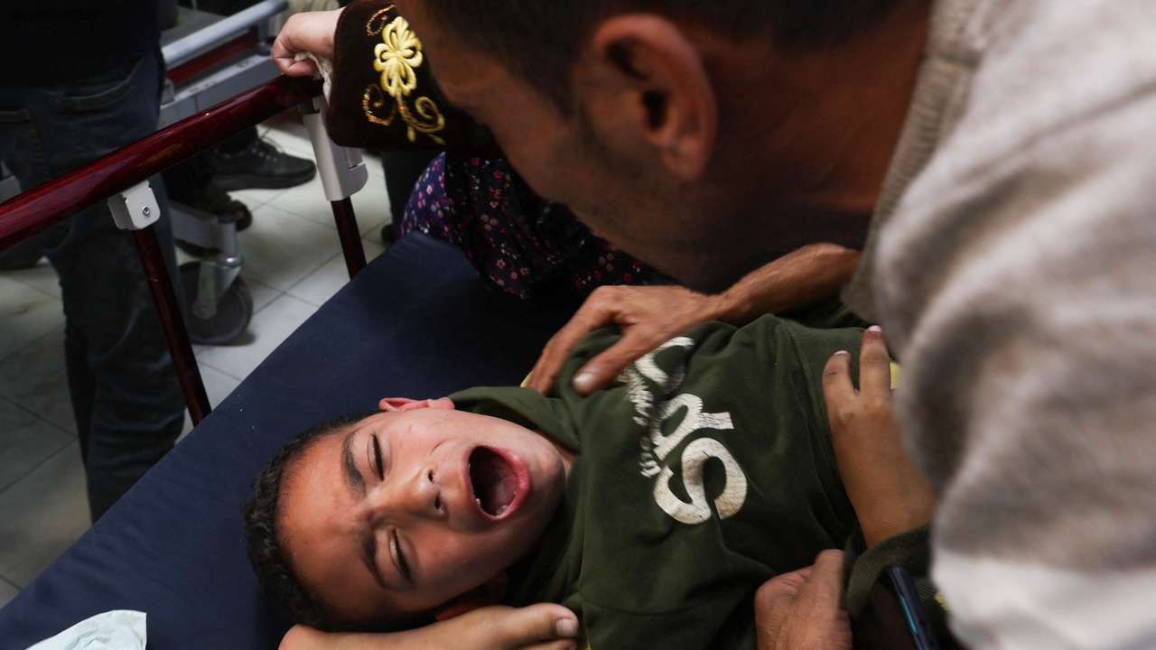 A Palestinian boy is assisted following an Israeli strike strike at Nasser hospital in Khan Younis