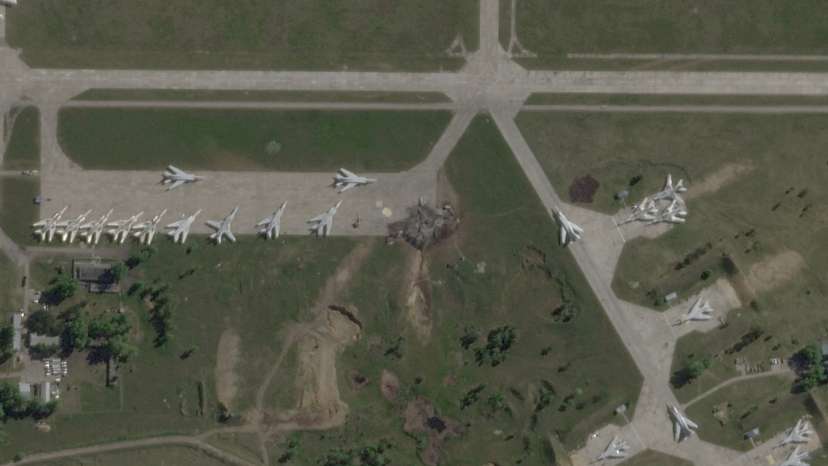 FILE PHOTO: Satellite view shows damaged planes and tarmac at Russian Belaya airfield
