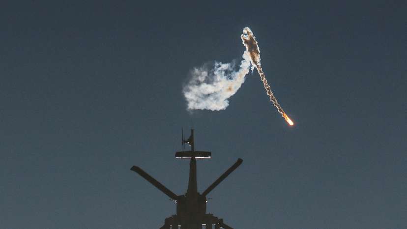 An Israeli military helicopter releases a flare over the Israel-Gaza border, after a temporary truce between Israel and the Palestinian Islamist group Hamas expired, as seen from southern Israel